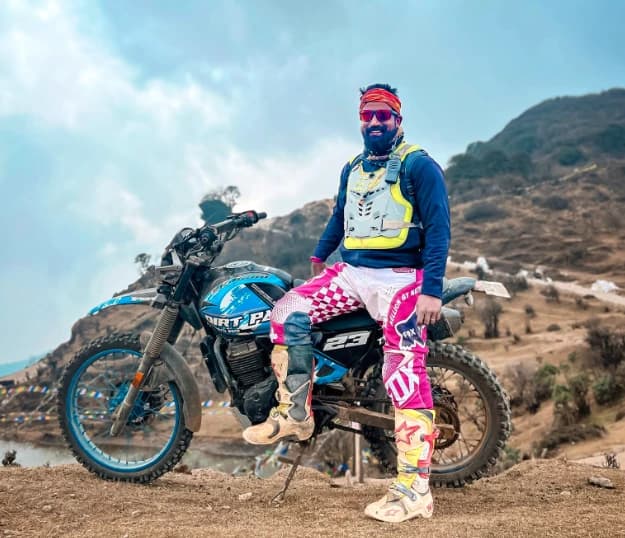 Prasanta Barik with his motorcycle in the mountains